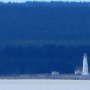 <p align="left">Avant d'arriver, au loin, le phare de la Pointe-Carleton.